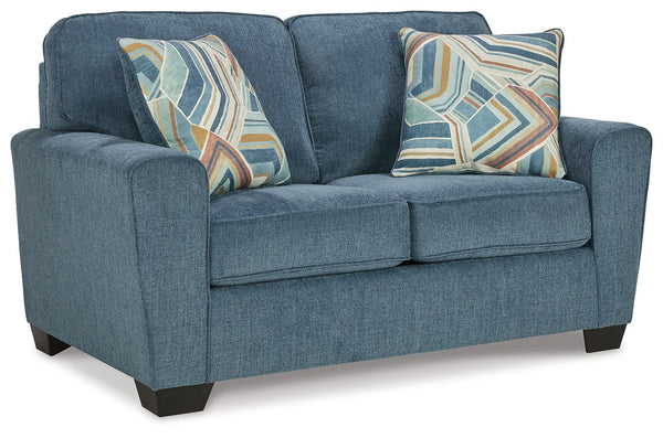 Need a simple style refresh? Liven up your living room essentials with this loveseat. A chunky silhouette holds invitingly ample cushioning you-'ll long to lounge in. Crosshatched upholstery and accent pillows give the otherwise casual design a delightful