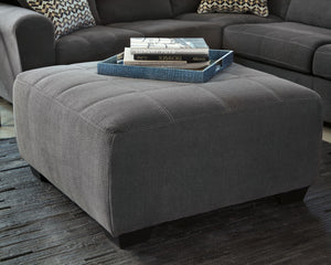  this oversized ottoman makes it look effortless. With its gently weathered hue and plush feel