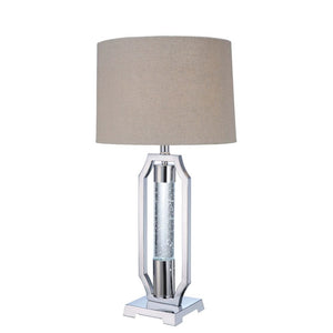 Gleaming and modish, this Cici table lamp will add a hint of luxury to any space. It is crafted in chrome and has light brown fabric drum shade. Featuring metal base with single acrylic cylinder with G9 LED and 4-way rotary switch, the exceptional design 