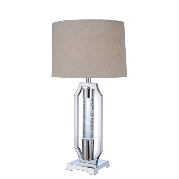 Gleaming and modish, this Cici table lamp will add a hint of luxury to any space. It is crafted in chrome and has light brown fabric drum shade. Featuring metal base with single acrylic cylinder with G9 LED and 4-way rotary switch, the exceptional design 