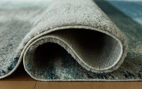  gray and ivory hues come together in luxe harmony. Layer the rug on the floor of your living room or bedroom for an utterly indulgent effect.<br/><b