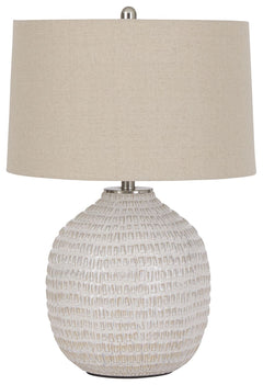 Style and function come together in this textured ceramic lamp to bring incandescent style to any space in your home. Combining a rounded base, accented with goldtone hardware, this lamp is capped off with a simple natural lampshade for complete elegance.