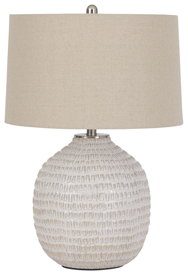 Style and function come together in this textured ceramic lamp to bring incandescent style to any space in your home. Combining a rounded base, accented with goldtone hardware, this lamp is capped off with a simple natural lampshade for complete elegance.