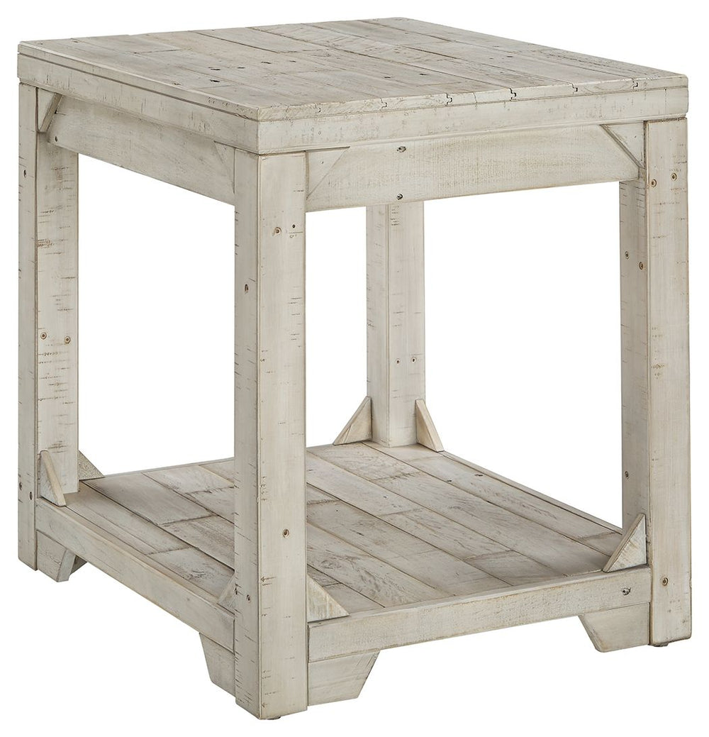Take in the country fresh look of this end table and connect with a simpler time. Its farmhouse style is evident in its stocky design with planked top/bottom shelf, unique triangle accents and relaxed white washed finish. With a handcrafted look thanks to