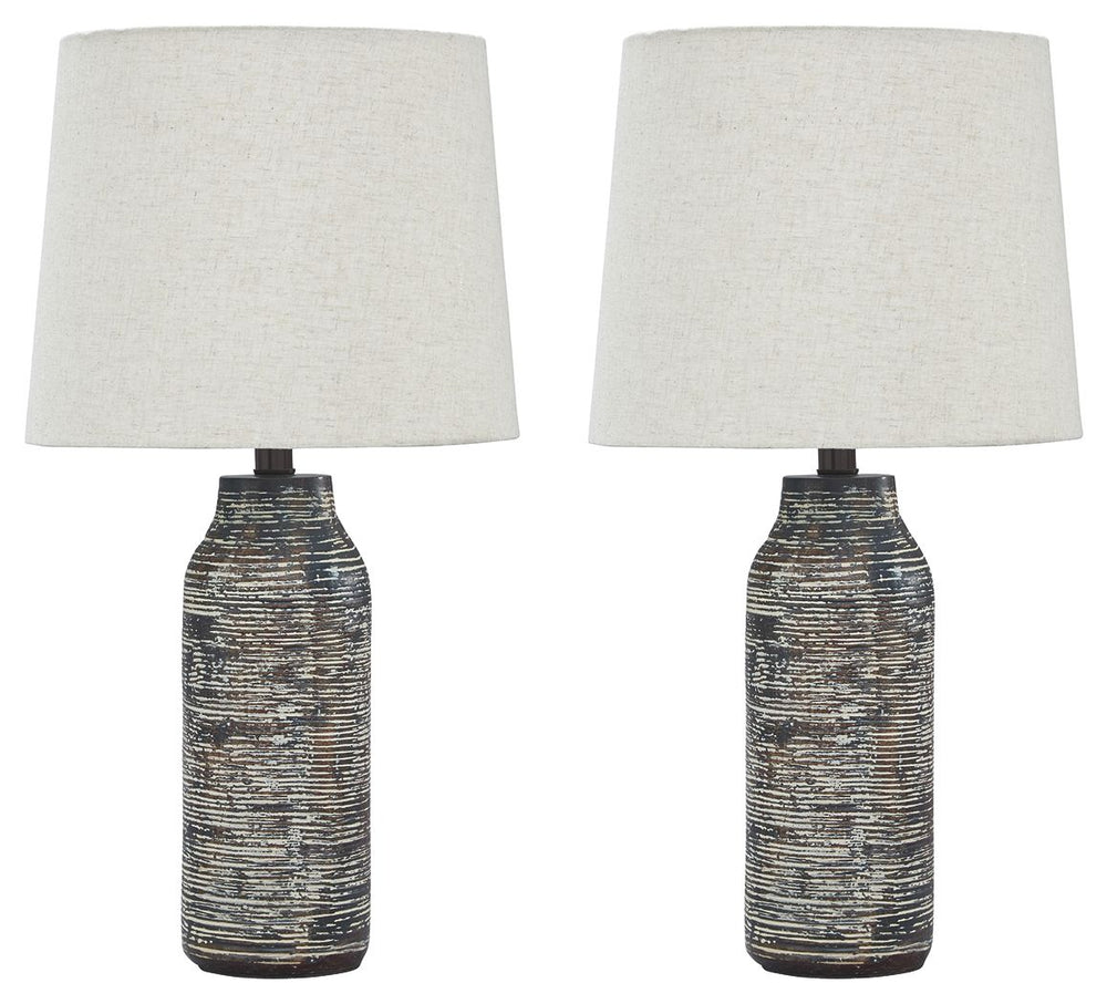 Effortless with a fashionable edge. This table lamp lights your home with urban industrial vibes. A black and white finished paper composite surrounds the base with a worn, textural aesthetic.<br><br><b>Additional Dimensions</b><br><ul><li>Shade: 0-"</li>