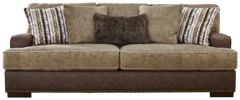 Punctuated by a subtle band of nailhead trim, this sofa is perfect for those who love the look of leather. Two textural tones provide twice the style and comfortâ€”and incorporate an added layer of visual interest. Throw pillows add a fun decorative eleme