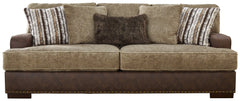 Punctuated by a subtle band of nailhead trim, this sofa is perfect for those who love the look of leather. Two textural tones provide twice the style and comfortâ€”and incorporate an added layer of visual interest. Throw pillows add a fun decorative eleme