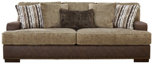 Punctuated by a subtle band of nailhead trim, this sofa is perfect for those who love the look of leather. Two textural tones provide twice the style and comfortâ€”and incorporate an added layer of visual interest. Throw pillows add a fun decorative eleme