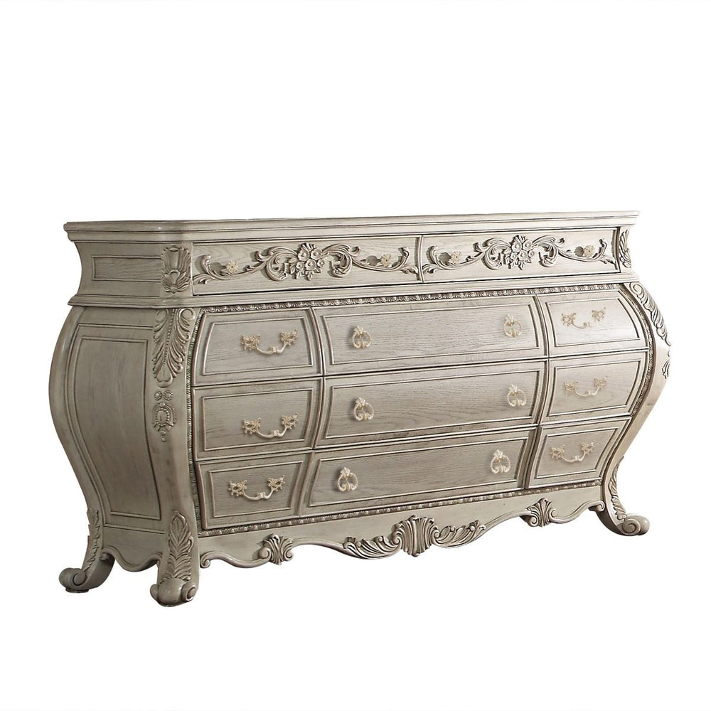 The Ragenardus dresser is an impeccable example of truly memorable luxurious traditional design. This eleven-drawer antique white dresser features a detailed French style front and English back in a stunning Bombay shape case, Felt-Lined top drawer, side 