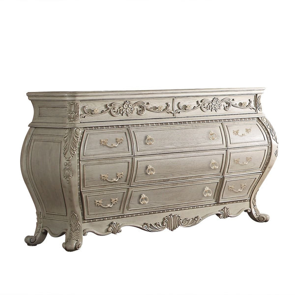 The Ragenardus dresser is an impeccable example of truly memorable luxurious traditional design. This eleven-drawer antique white dresser features a detailed French style front and English back in a stunning Bombay shape case, Felt-Lined top drawer, side 