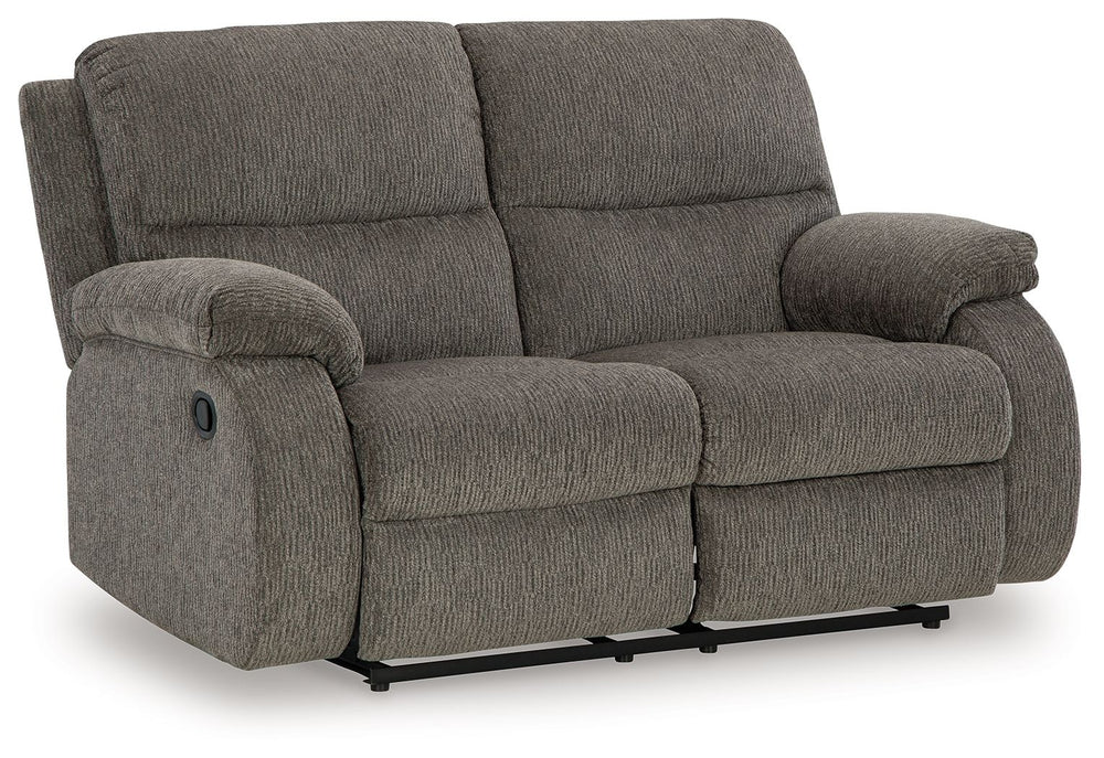Craving a simple spot to relax and recharge? This reclining loveseat encourages you to take a break from the everyday grind. Its contemporary bustle back and versatile hue bring stylishly soft comfort to a seating area. And when youâ€™re ready to recline,