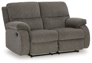 Craving a simple spot to relax and recharge? This reclining loveseat encourages you to take a break from the everyday grind. Its contemporary bustle back and versatile hue bring stylishly soft comfort to a seating area. And when youâ€™re ready to recline,
