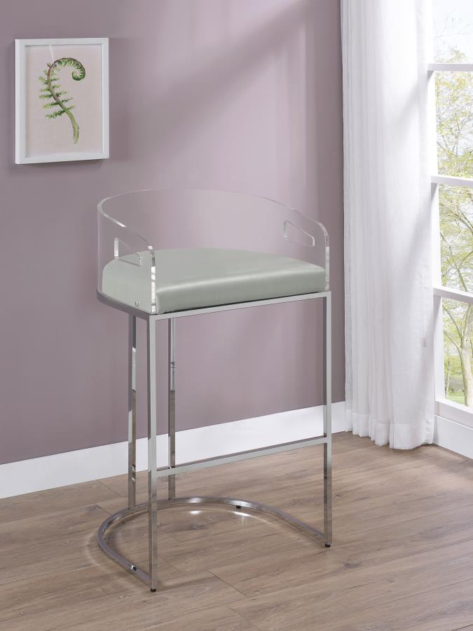 Ultra-modern with a retro-inspired vibe, this pair of stools make a striking piece to a dining room space. With a curved backrest in a clear acrylic material, each stool offers an open and airy design. Rest comfortably on a leatherette cushion as you dine