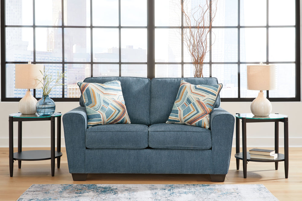 Need a simple style refresh? Liven up your living room essentials with this loveseat. A chunky silhouette holds invitingly ample cushioning you-'ll long to lounge in. Crosshatched upholstery and accent pillows give the otherwise casual design a delightful