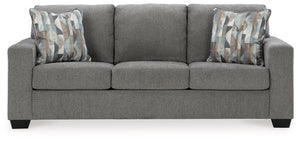 Youâ€™re in for a neat treat with this sofa. Its comfy seats are covered in soft, textural upholstery, and the wide track arms are eager to support your quest for total relaxation. Distressed abstract toss pillows bring a fresh breath of contemporary styl