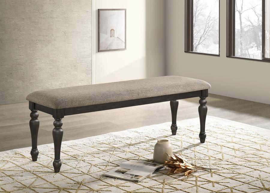 Instill casual elegance at a dining table or bring a refined touch to your entryway with a traditional backless bench. Its streamlined silhouette is accentuated with beautiful turned legs, offering classic character and dimensionality in any room. The ver