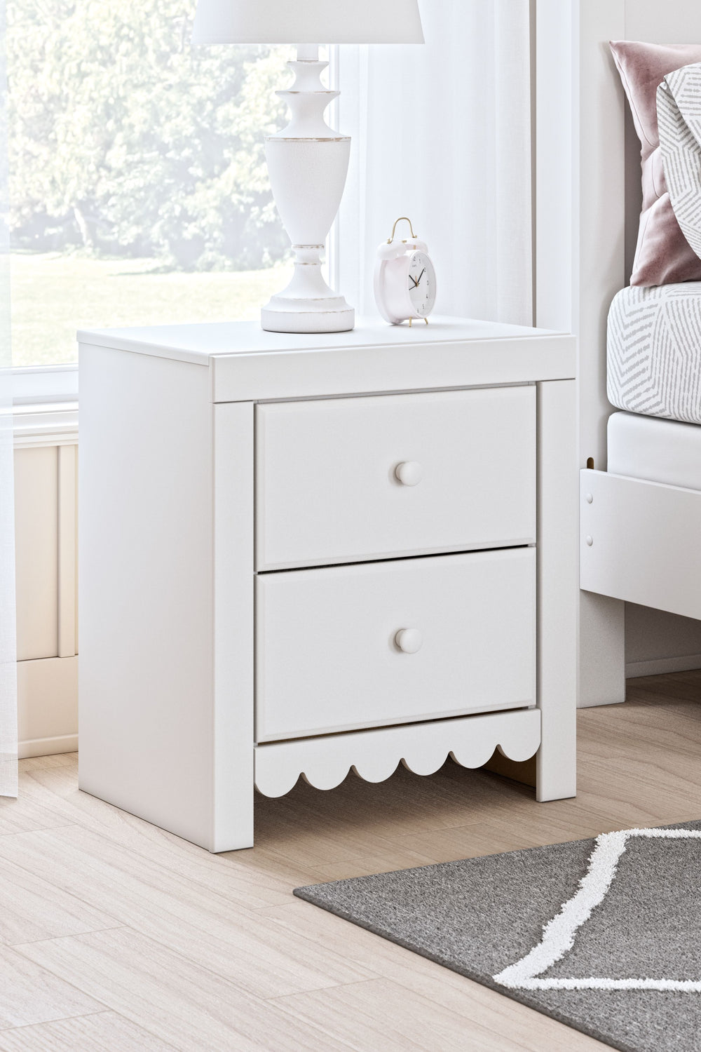 Make waking up or bedtime that much more magical with this nightstand. Charmingly cute with its scalloped detailing, it appeals to both her sense of playful whimsy and your love for modern design. The nightstand-'s included USB charging keeps devices or n
