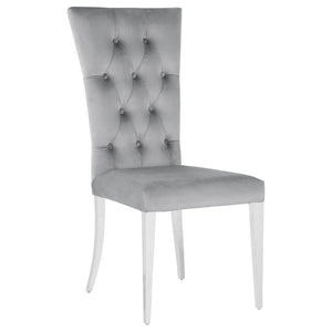  these two chairs boast a tall curved back for extra comfort and support throughout long dinners. Upholstered in a pl