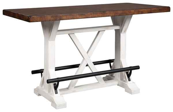 A high-style choice for smaller spaces, this counter height dining table serves up the best in rustic farmhouse living. Its two-tone finish pairs a brown tabletop with a distressed vintage white base for a double helping of charm. Black metal foot rests a