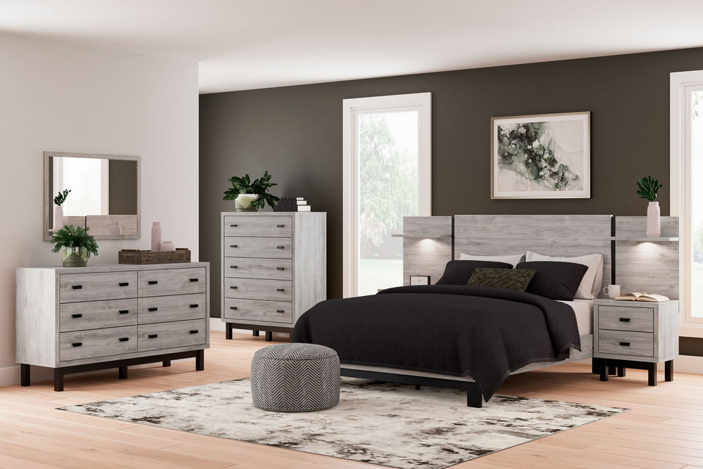 Craft a contemporary hideaway without breaking the bank. An elegant juxtaposition of refined neutral hues, the two-toned Vessalli queen panel bed with extensions brings sleek style to your space. The sheer simplicity of its profile stunningly frames your 