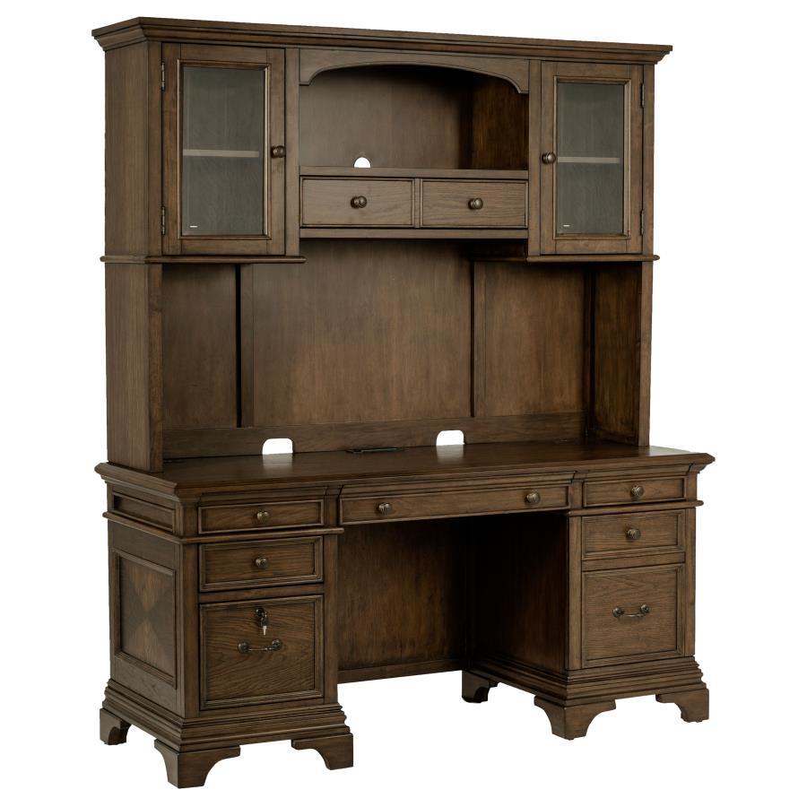 This burnished oak credenza with hutch is bound to enhance your office space. Stately and traditional in style, there is plenty of storage space with five drawers, two top cabinets, and two lower cabinets that lock for safekeeping. Crown molding detailing