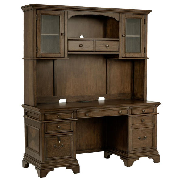 This burnished oak credenza with hutch is bound to enhance your office space. Stately and traditional in style, there is plenty of storage space with five drawers, two top cabinets, and two lower cabinets that lock for safekeeping. Crown molding detailing