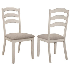 Enhance the cozy atmosphere of your dining space with our modern farmhouse and coastal cottage dining side chairs. These ladder back chairs exude a charming rustic appeal with their distressed cream finish on the legs and back. The khaki polyester fabric 