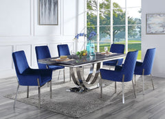 Update your dining space with the Cambrie dining collection. The table features an eye-catching metal geometric pedestal base that is sure to leave your dinner guests impressed. The ample faux marble tabletop adds more visual interest to the piece. The ma