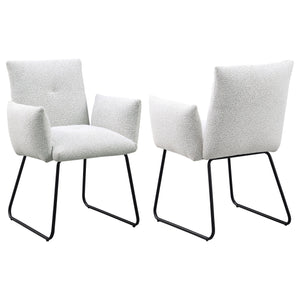 Elevate your dining experience with this modern dining chair, designed for both comfort and style. Upholstered in soft fabric, this chair provides a cozy seat for everyday dining or special gatherings. The chair features a contemporary design with gently 