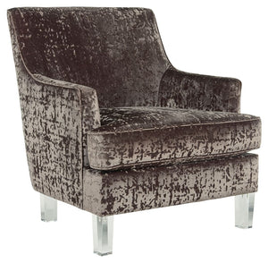 This accent chair with shelter arm styling merges contemporary and traditional styling in the most beautiful way. The combination of polyester crushed velvet upholstery and tapered clear acrylic legs makes for one cool contrast. Combining comfort and fash