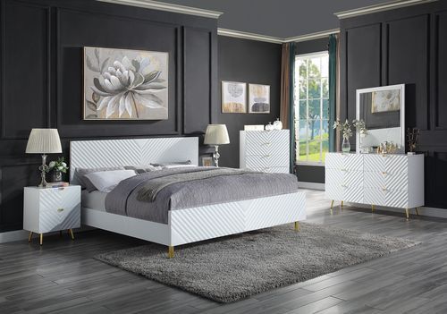 The Gaines Collection is a glamorous and sophisticated grouping that adds a chic style to any room. The white gloss finish and gold metal accents help to accentuate the clean lines of the pieces and add a pop of glamour. The diagonal line design adds visu