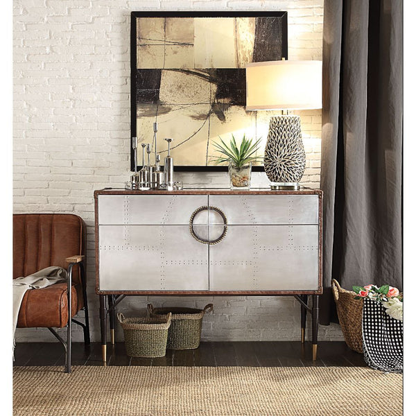  the Brancaster console table is inspired by mid-20th-century air travel. This unique console piece features ample storage with two drawers and cabinet space with two doors