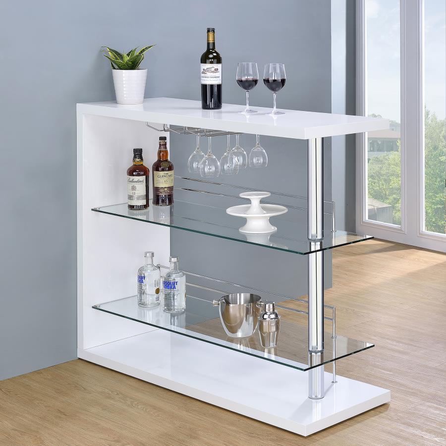This contemporary bar unit will instantly elevate your hosting abilities. Convenient and versatile, it includes two glass shelves to accommodate your choice of beverages. It comes complete with a handy wine glass rack, allowing you to keep all your barten