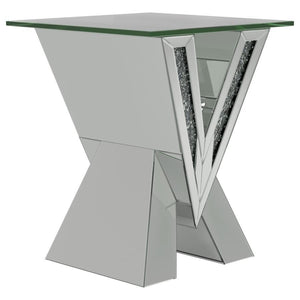 This mirrored end table brings a bold, artistic flair to any living space. Its striking V-shaped base features mirrored panels and glittering crystal accents, creating a glamorous and reflective design. Topped with a square, beveled tempered glass surface