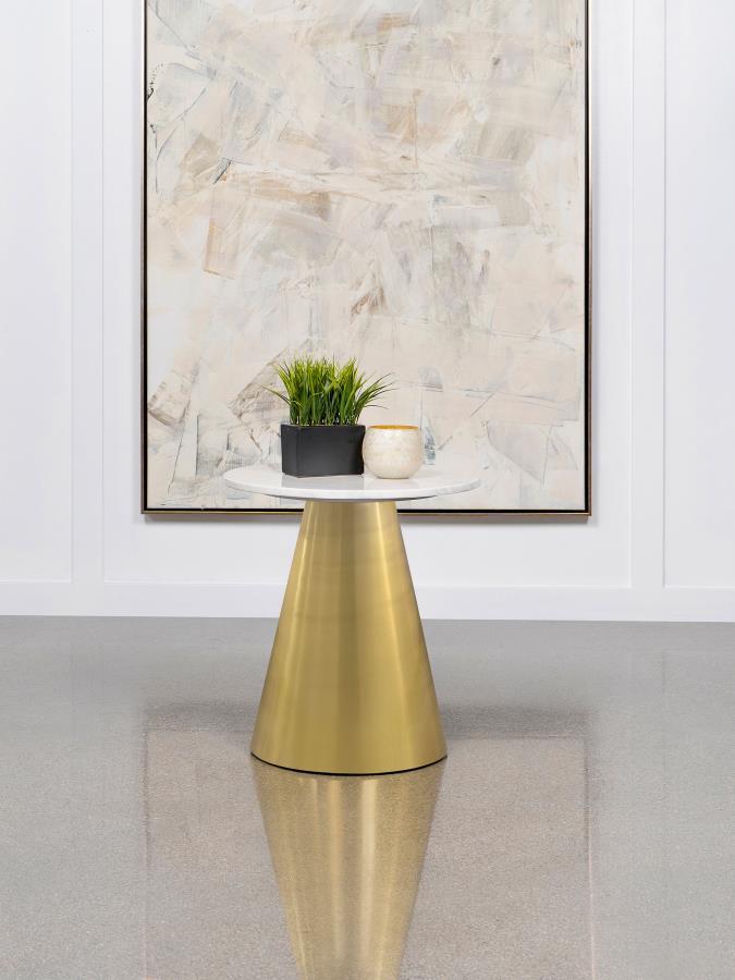 This elegant side table embodies sculpted grace with its luxurious white marble top. The round silhouette creates a refined, sophisticated spot for refreshments or decorative accents. Beneath, the metal pedestal base features a gleaming gold finish, infus