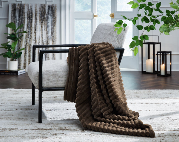  this faux fur throw turns your seating area into a haven of comfort. Its neutral hue acts as the perfect foundation for layering