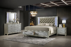 Discover the elegance of the Radiance King 4 Piece Bedroom Set in Platinum Silver, featuring a storage bed, 6 drawer dresser, lighted mirror, and 2 drawer nightstand, meticulously crafted for unparalleled stability and durability from a blend of solid rub