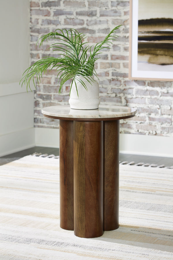  appealing to the luxurious but inviting vibe of your contemporary aesthetic. A beige marble top pairs with cylindrical legs in a brown finish