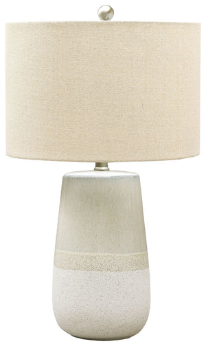 With a textured neutral glaze, this monochromatic table lamp brings thoughts of sun, surf and sand to your space. Turn coastal chic to the contemporary side with this transitional lamp.<br><br><b>Additional Dimensions</b><br><ul><li>Cord length: 96-"</li>