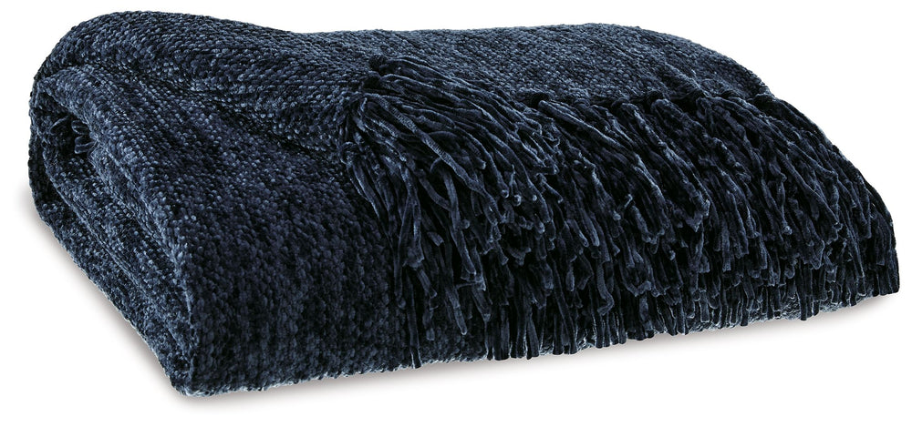 A lovely layer to cozy up with, this dark blue throw also makes a stylish statement. Whether the blanket is draped over the arm of a sofa or folded at the foot of a bed, its woven texture and knotted fringe give it a homespun look that-'s relaxed and invi