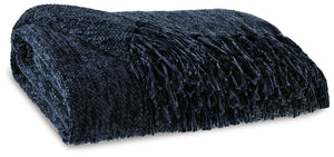 A lovely layer to cozy up with, this dark blue throw also makes a stylish statement. Whether the blanket is draped over the arm of a sofa or folded at the foot of a bed, its woven texture and knotted fringe give it a homespun look that-'s relaxed and invi
