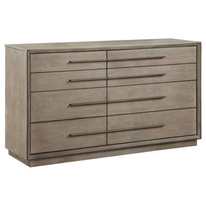 An asymmetric centerline creates a touch of artistry for this transitional eight-drawer dresser. Designed for spacious storage of clothing and accessories, it features drawers of varying sizes, creating easy organization. A Taupe oak wood finish is soft a