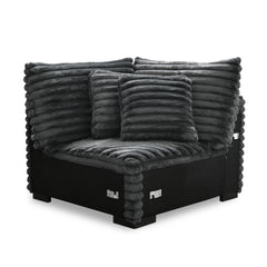 The Embrace Sectional Wedge with 2 Accent Pillows in charcoal gray is a stylish and functional addition to your sectional setup. Upholstered in 100% charcoal gray polyester fabric with a plush, blanket-like texture, this wedge promises ultimate relaxation