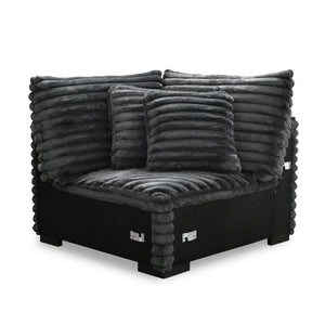 The Embrace Sectional Wedge with 2 Accent Pillows in charcoal gray is a stylish and functional addition to your sectional setup. Upholstered in 100% charcoal gray polyester fabric with a plush, blanket-like texture, this wedge promises ultimate relaxation