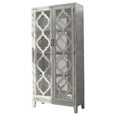 Showcase your cherished items in this striking display cabinet, crafted with intricate lattice wood overlay and mirrored back panels for added depth and elegance. Framed glass doors open to reveal three shelves ideal for displaying collectibles or dinnerw