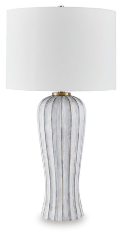 Classic sophistication meets modern sensibility. The gracefully fluted base of this table lamp brings a dynamic feel to the white shade-'s crisp look. Finished in a versatile antiqued gray, the transitional piece effortlessly bridges casual and contempora