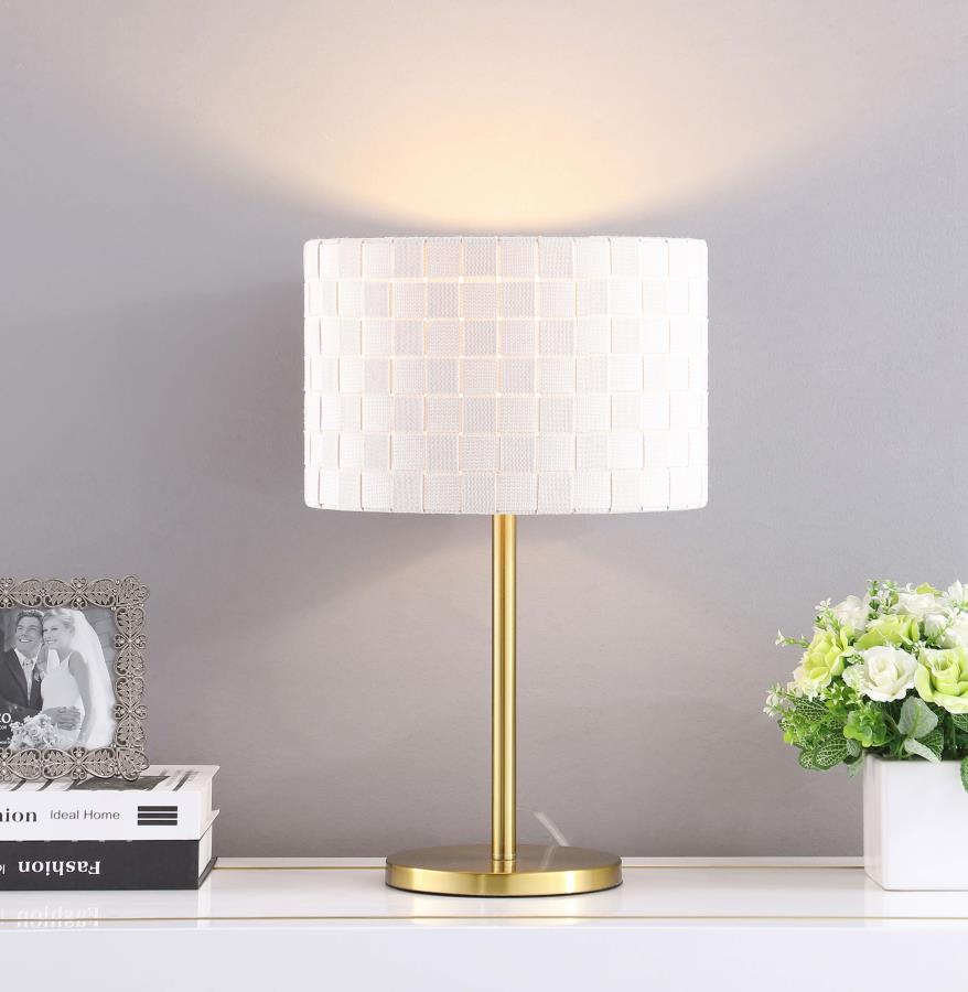 Itâ€™s all in the shade, an elegant texturized look that brings an exquisite element to your living room, entryway, or master bedroom. The Ramiro table lamp reflects careful styling for versatile use and a mix of old and new design motifs. Its gleaming go