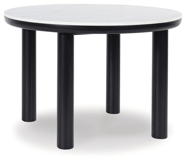 Clean lines meet cool curves with this dining table. Chunky round post legs and a black finish lend a modern vibe, while a replicated white marble top completes the casual lifestyle design. What a delicious choice for a dining room update.<br><br><b>Addit