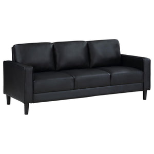 Establish the foundation of a stylish living room with a modern sofa. Smooth faux leather creates a sleek, neutral look that brims with sophistication. Track arms create a structured silhouette, offering tailored flair with an understated ambiance. Straig