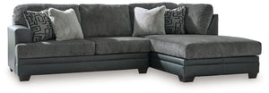 Appeal to your eye for ultra-contemporary design with this sectional. Chic and sleek in dark neutrals, it pairs cozy fabric with faux leather for invitingly cool character. And with a roomy chaise offering extra seating space, family and friends can chill